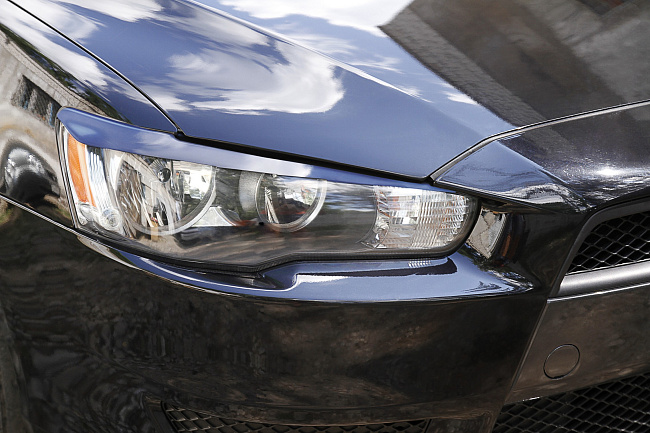 картинка Mitsubishi Lancer X 2011-2014 Накладки на передние фары (реснички) компл.-2 шт. магазин  StreetTuning 