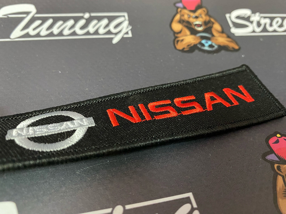 картинка Брелок для ключей Nissan "тканевый", черный от магазина  StreetTuning